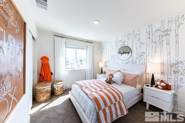 bedroom featuring dark colored carpet