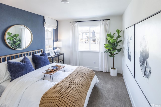 bedroom with dark colored carpet