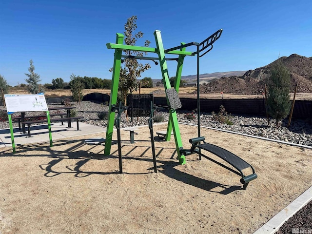 view of playground with a mountain view