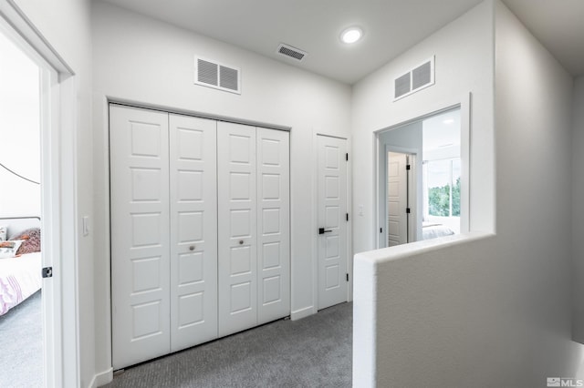 corridor with carpet floors