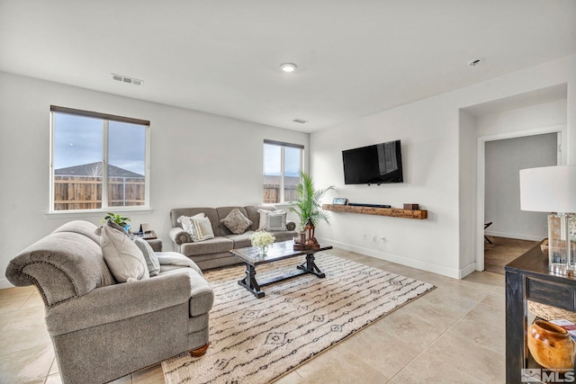 living room with light tile patterned flooring