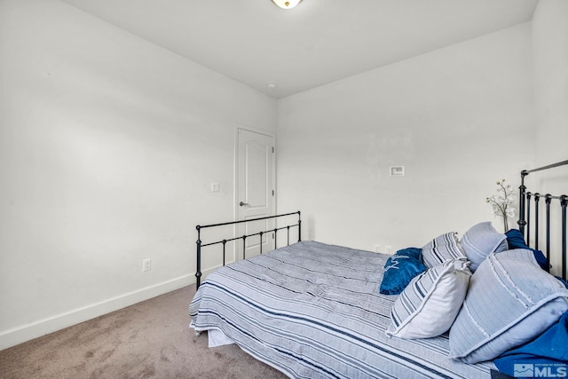 bedroom featuring light carpet