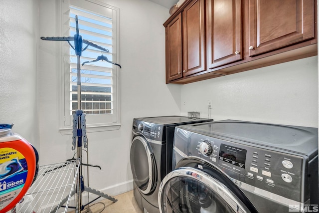 laundry area featuring cabinets and independent washer and dryer