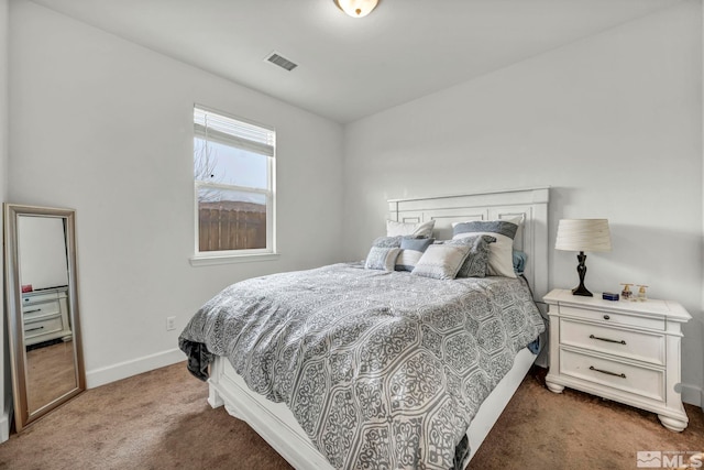 bedroom featuring dark carpet