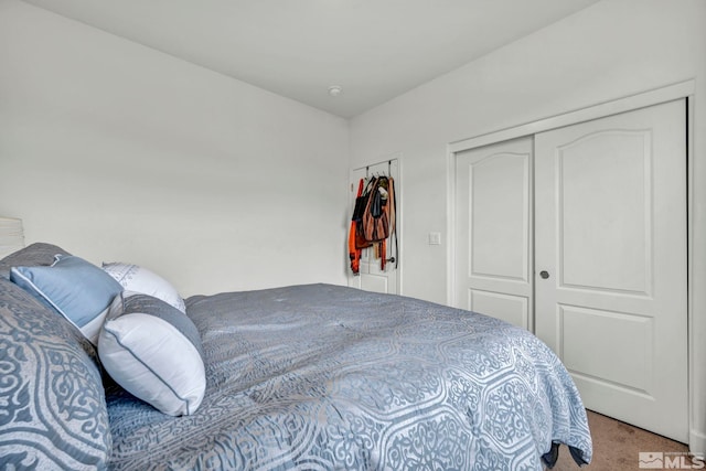 carpeted bedroom with a closet