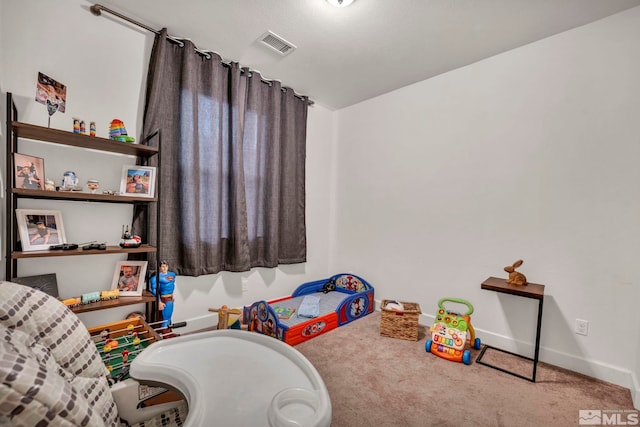 game room featuring light carpet