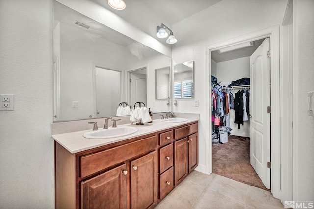 bathroom with vanity and tile patterned flooring