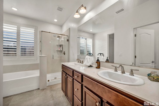 bathroom with vanity, tile patterned floors, and shower with separate bathtub