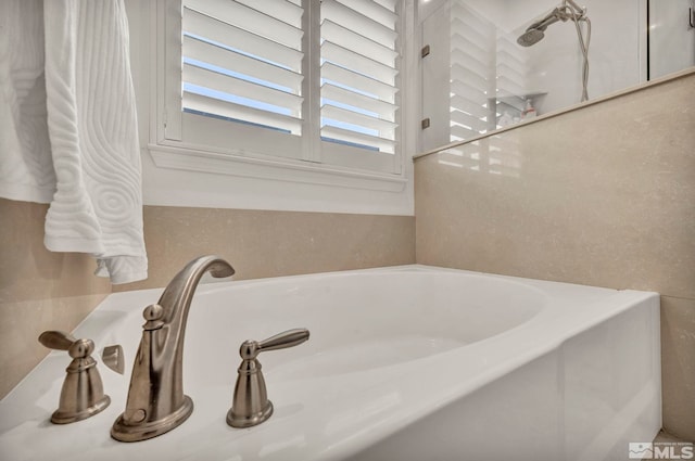 bathroom featuring a tub to relax in