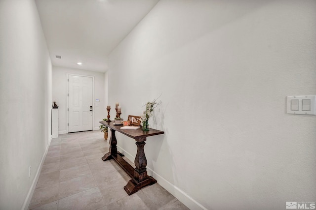 hallway featuring light tile patterned flooring