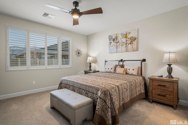 bedroom with ceiling fan and light carpet