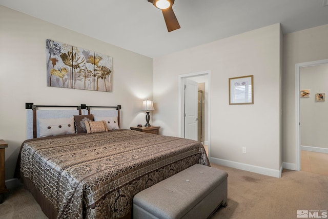 bedroom featuring light colored carpet and ceiling fan