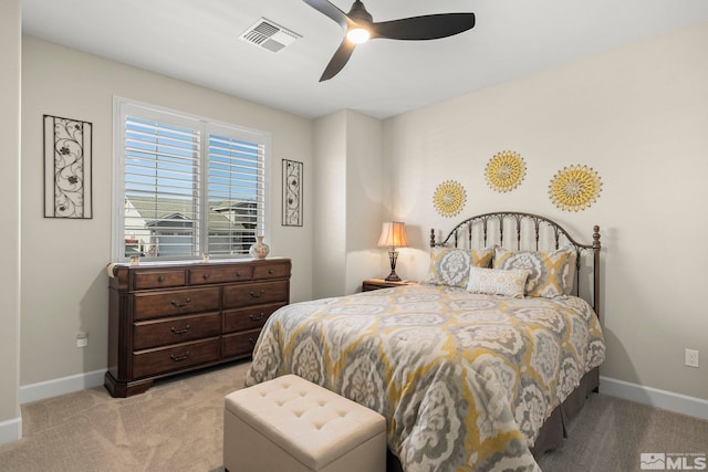 bedroom with light colored carpet and ceiling fan