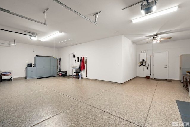 garage featuring a garage door opener and water heater