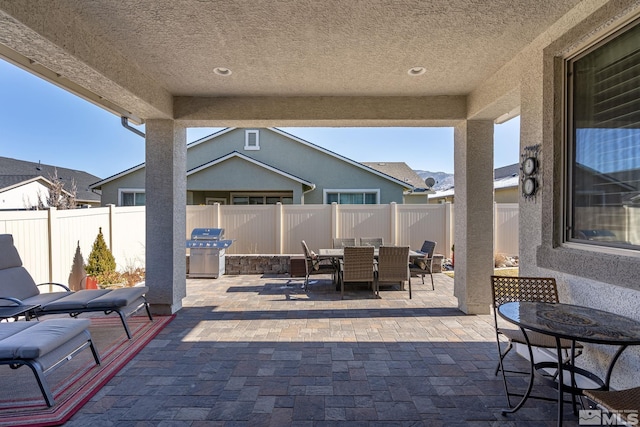 view of patio with a grill