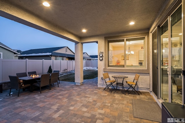 view of patio terrace at dusk