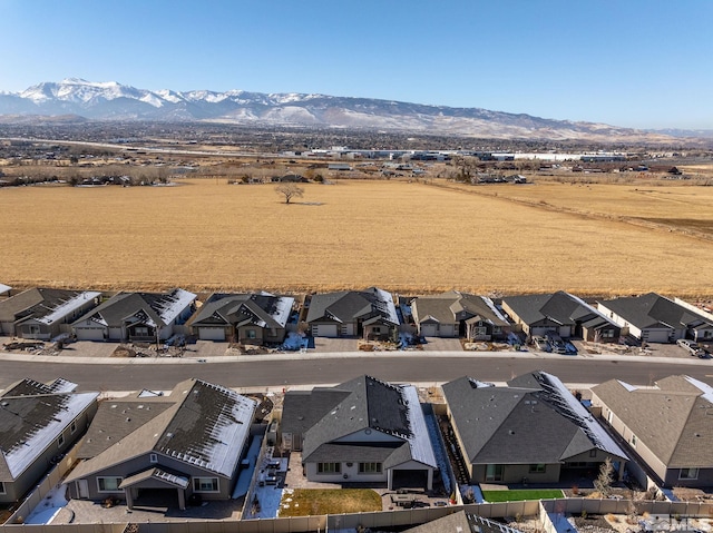 birds eye view of property featuring a mountain view