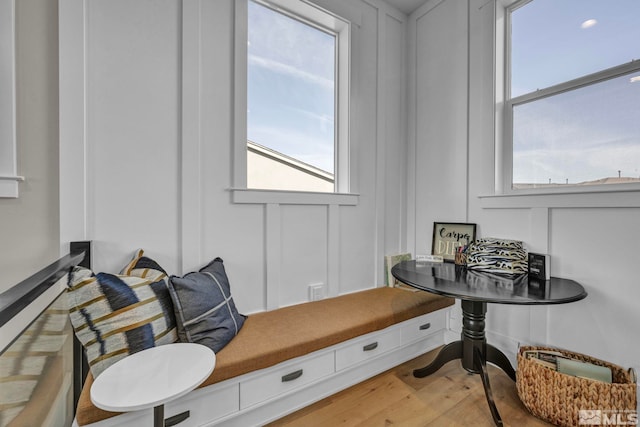 sitting room featuring hardwood / wood-style flooring and plenty of natural light