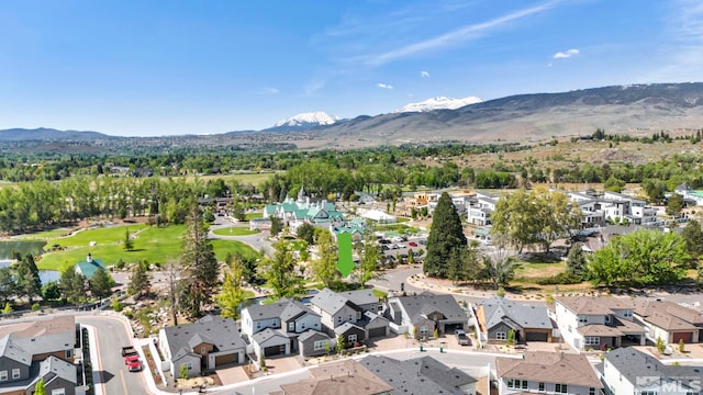 birds eye view of property featuring a mountain view