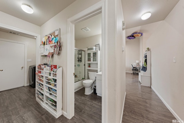 corridor featuring dark hardwood / wood-style floors