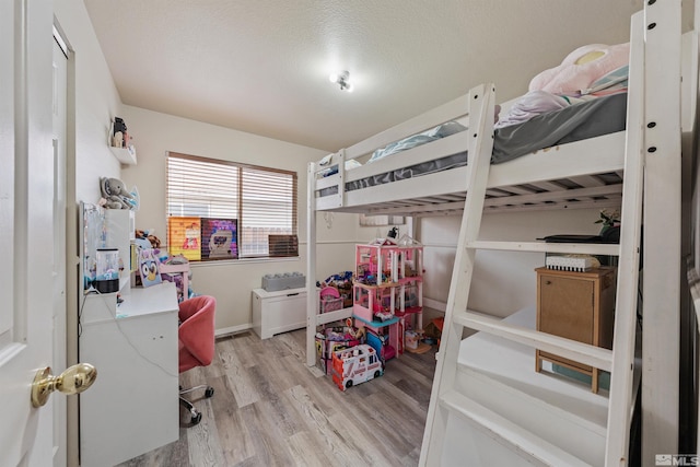 bedroom with light hardwood / wood-style flooring