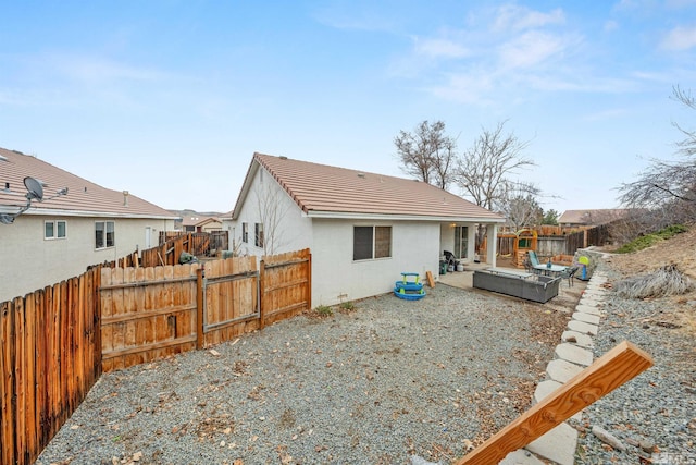 rear view of house featuring a patio