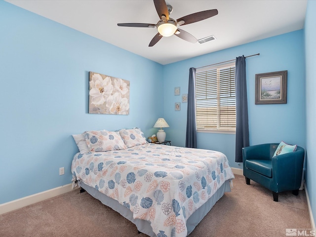 bedroom featuring light colored carpet and ceiling fan