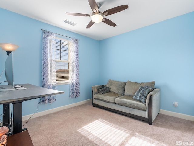 home office with ceiling fan and light colored carpet