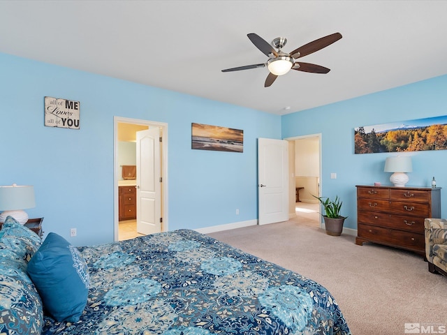 carpeted bedroom featuring connected bathroom and ceiling fan