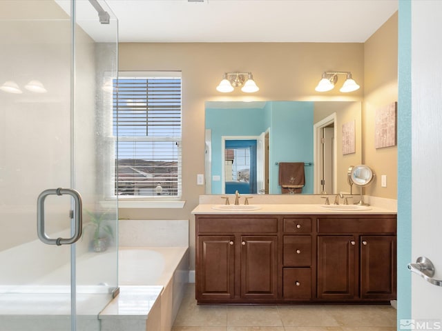 bathroom with vanity, tile patterned flooring, and shower with separate bathtub