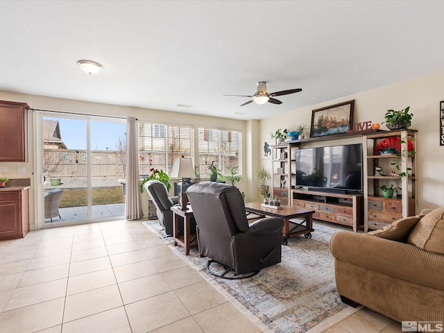 living room featuring ceiling fan and light tile patterned flooring