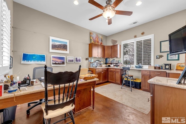 home office with ceiling fan and a wealth of natural light