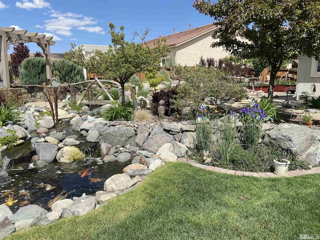 view of yard with a small pond