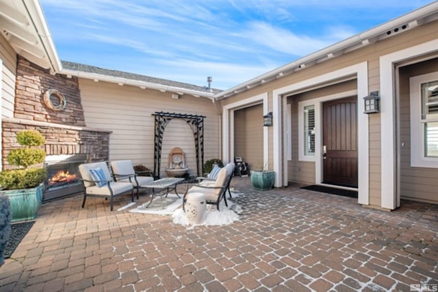 view of patio with a fire pit