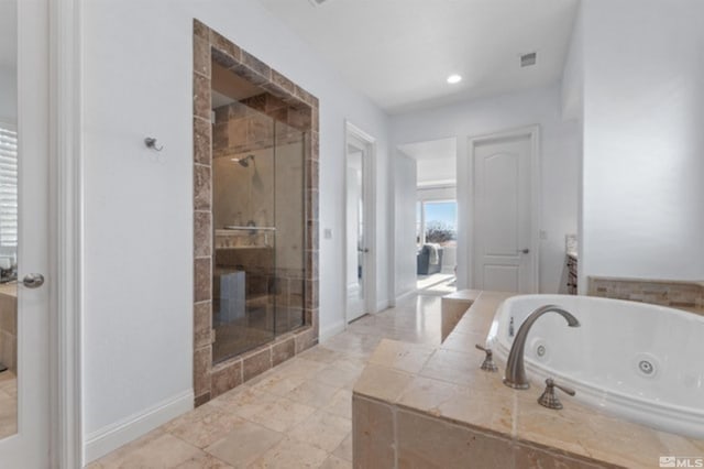 bathroom featuring shower with separate bathtub and vanity