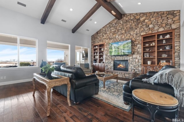 living room featuring a fireplace, beam ceiling, dark wood-type flooring, and high vaulted ceiling