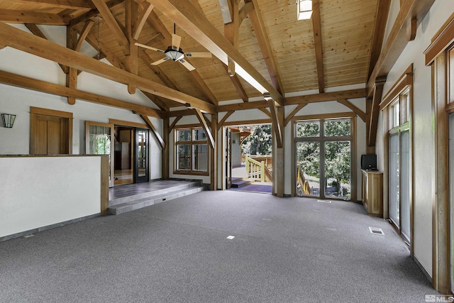 interior space with lofted ceiling with beams, wood ceiling, and ceiling fan