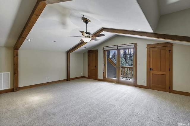 additional living space with light carpet, lofted ceiling with beams, and ceiling fan