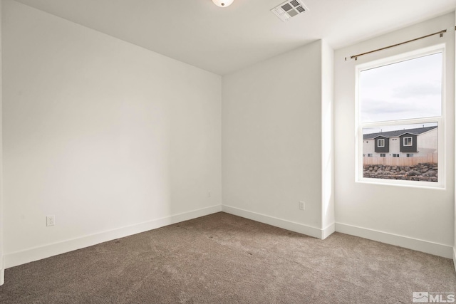 empty room featuring light colored carpet