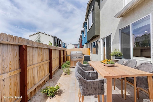 view of patio featuring a grill