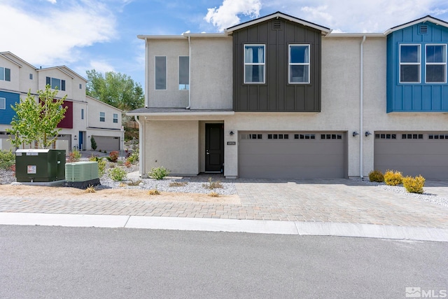 multi unit property with a garage and cooling unit