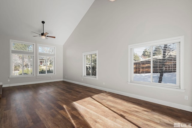 unfurnished living room with ceiling fan, a healthy amount of sunlight, high vaulted ceiling, and wood-type flooring