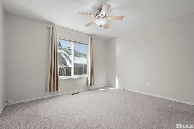 carpeted empty room with ceiling fan