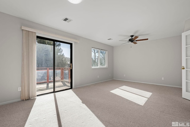 unfurnished room featuring light colored carpet and ceiling fan