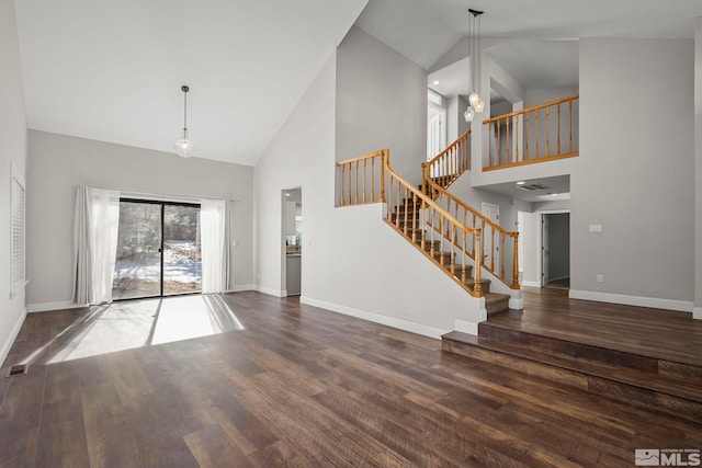 interior space with high vaulted ceiling and dark hardwood / wood-style flooring