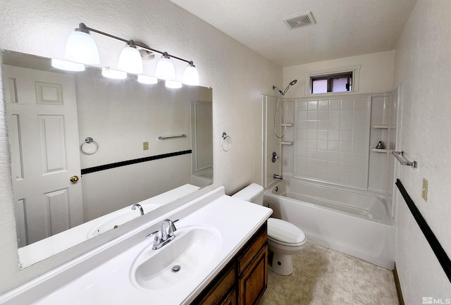 full bathroom with vanity, tub / shower combination, and toilet