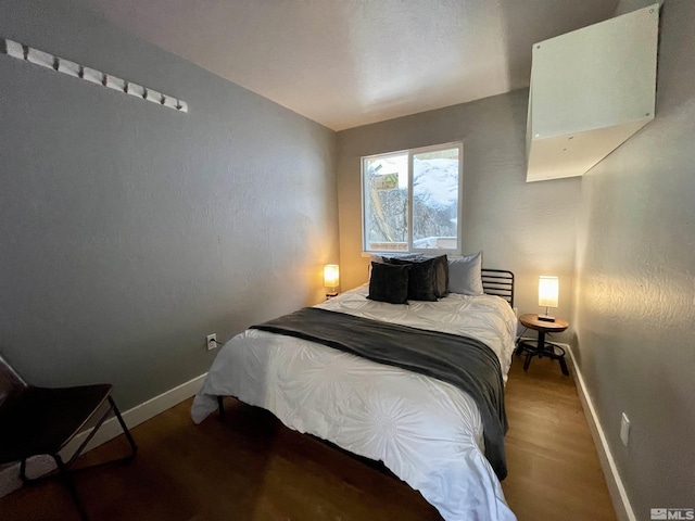 bedroom featuring baseboards