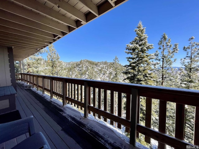 wooden deck with a mountain view