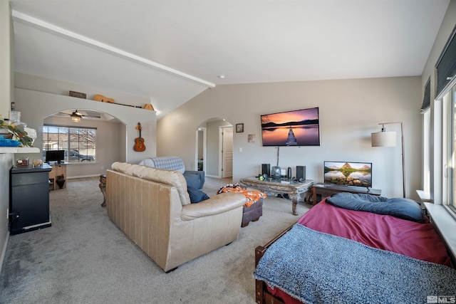 living room featuring lofted ceiling with beams and light carpet