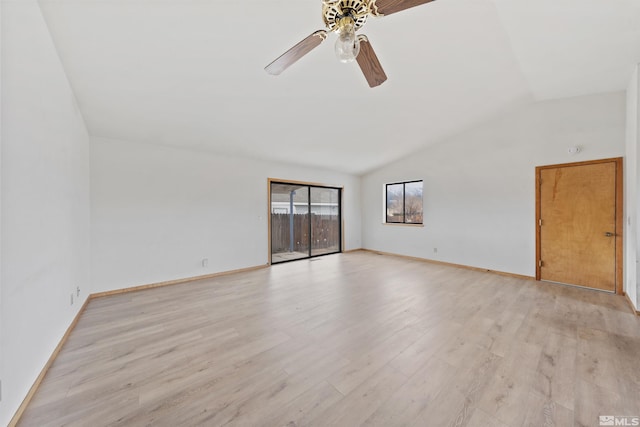 empty room featuring lofted ceiling, ceiling fan, and light hardwood / wood-style flooring